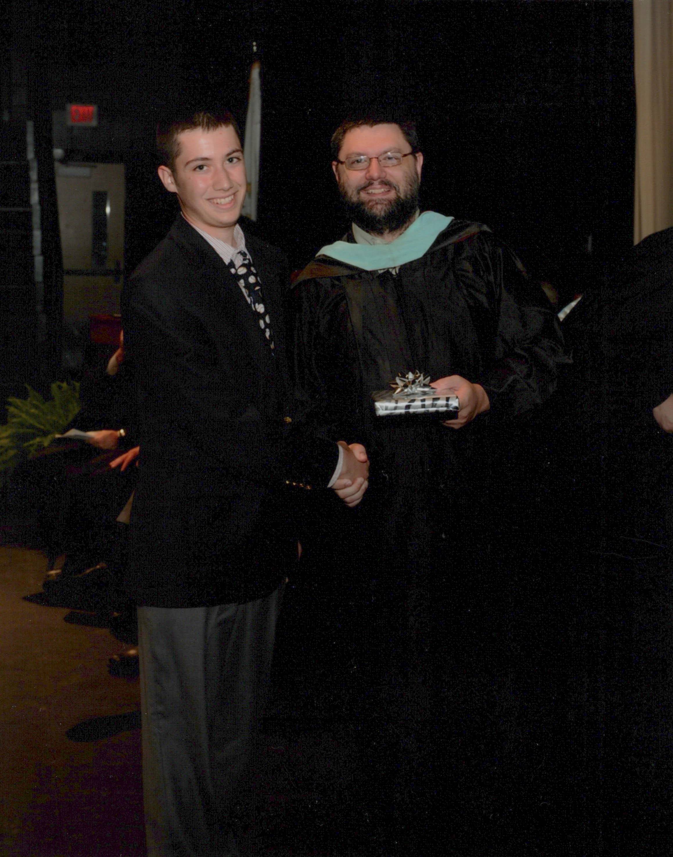 Joe Catalfamo receiving the American Mathematical Society Award at Bishop Hendricken